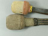 two knives that are wrapped in jute and rope