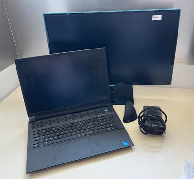 two laptops are sitting on a desk next to a monitor and mouse