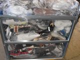 a cart full of shoes and other items in a warehouse