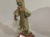 bronze figurine of a man with a hat and a cane