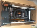 a cardboard box with a blower and other items in it