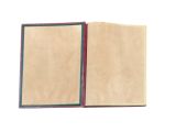 an open book with a red and green cover on a white surface