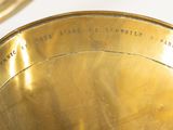 a close up view of a brass instrument with a bell