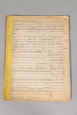 une vieille partition de musique avec une bordure jaune sur le haut