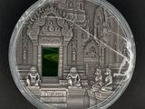 une image représentant une pièce d'argent sur laquelle figure l'effigie d'un temple