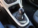 a close up of a car ' s gear lever in the center console