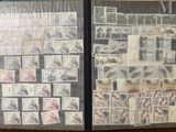 two pages of stamps on a table with a picture on them