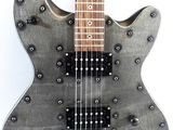 an electric guitar with a metal body and a wooden neck