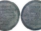 two silver coins with the names of two people on them