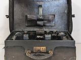 an old suitcase with a camera inside of it