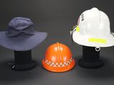 two hats and a hard hat sitting on top of each other