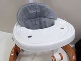 an image of a baby ' s high chair in a room