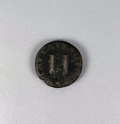 a close up of a coin with the letter u on it