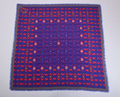 a blue and red rug with red and purple designs on it