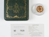 a close up of a small box with a coin and a card