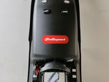 a close up of a black chair with a red and white logo on it