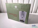 a box that has a coffee machine inside of it