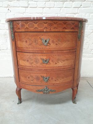 an old wooden chest of drawers with ornate carvings on it