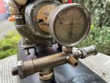 a close up of a gauge on the handlebar of a motorcycle