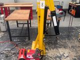 an image of a crane in a workshop with tools