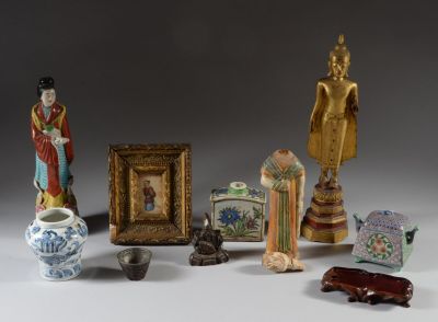 a lot of asian figurines on a white surface