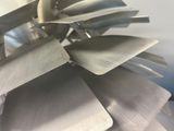 a close up view of a metal object with blades