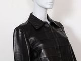 a mannequin mannequin wearing a black leather jacket