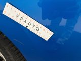 a close up of a sticker on a blue car