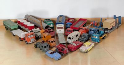 a lot of toy trucks that are sitting on the floor