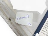 a piece of paper with a note on it next to a laptop