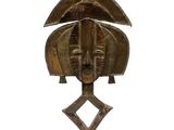 bronze sculpture of a woman ' s face on a wooden base