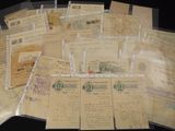 a pile of old letters and envelopes sitting on a table