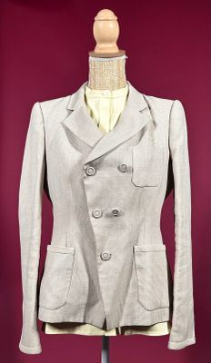 an image of a woman ' s jacket on a mannequin stand