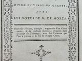 a close up of an old book with writing on it