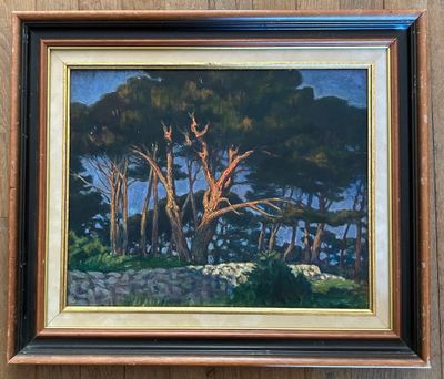 painting of trees in a wood frame hanging on a wall
