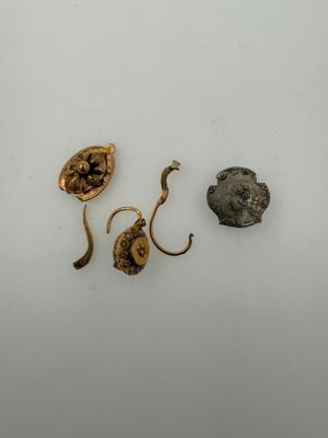 a close up of a piece of metal with a head on it