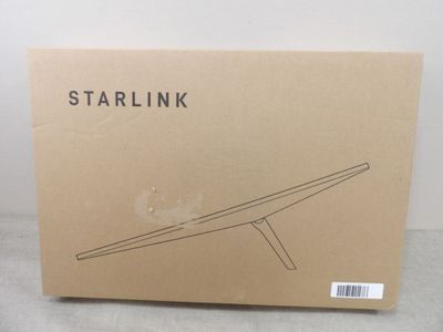 La boîte contenant la table Starlink est ouverte et prête à l'emploi.