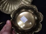 a person holding a gold plate with a price tag on it