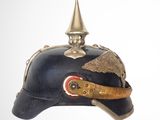 a blue helmet with a gold decoration on it