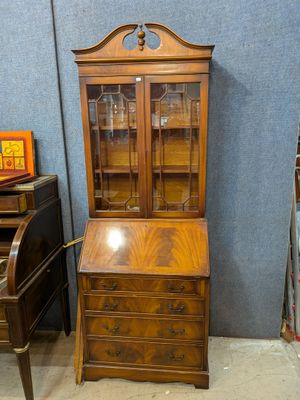 an image of a wooden desk with a glass front