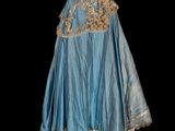 an image of a statue of a woman in a blue dress