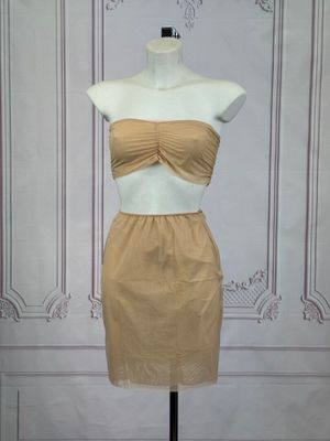 the mannequin dress is made of a tan colored material
