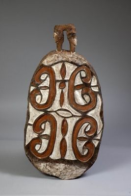 a close up of a decorative object on a white surface