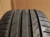 a close up of a tire on a cardboard box with a cardboard box in the background