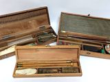 three wooden boxes with different types of items in them