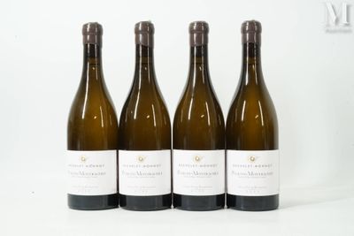 three bottles of wine are lined up on a white surface