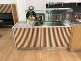 an image of a kitchen with a counter and a glass case