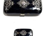 two black and white boxes with designs on them