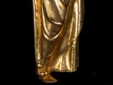 gold statue of a woman holding a baby in her arms
