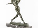 a statue of a woman holding a bird on top of a marble base